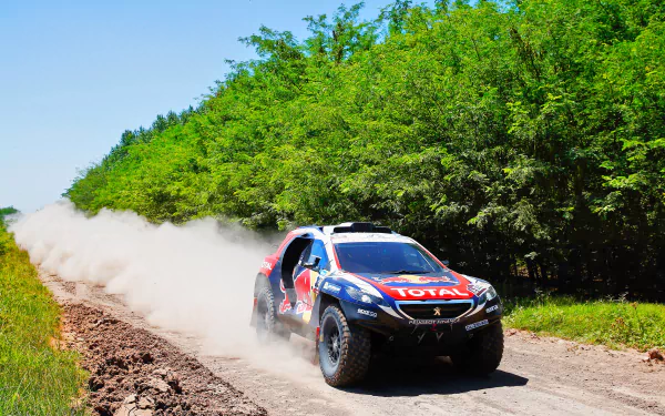 A rally car speeds along a dirt road surrounded by greenery, kicking up dust in this dynamic sports-themed HD desktop wallpaper.