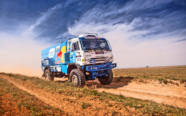 HD PC desktop wallpaper featuring a rallying sports vehicle racing on a dusty off-road track under a dynamic cloudy sky.