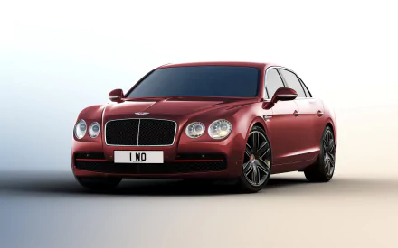 A sleek red Bentley Flying Spur car displayed as an HD PC desktop wallpaper, showcasing the luxury vehicle's elegant design and distinctive front grille.
