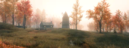 HD PC desktop wallpaper from The Elder Scrolls V: Skyrim featuring a misty autumn landscape with a wooden cabin and windmill surrounded by trees.