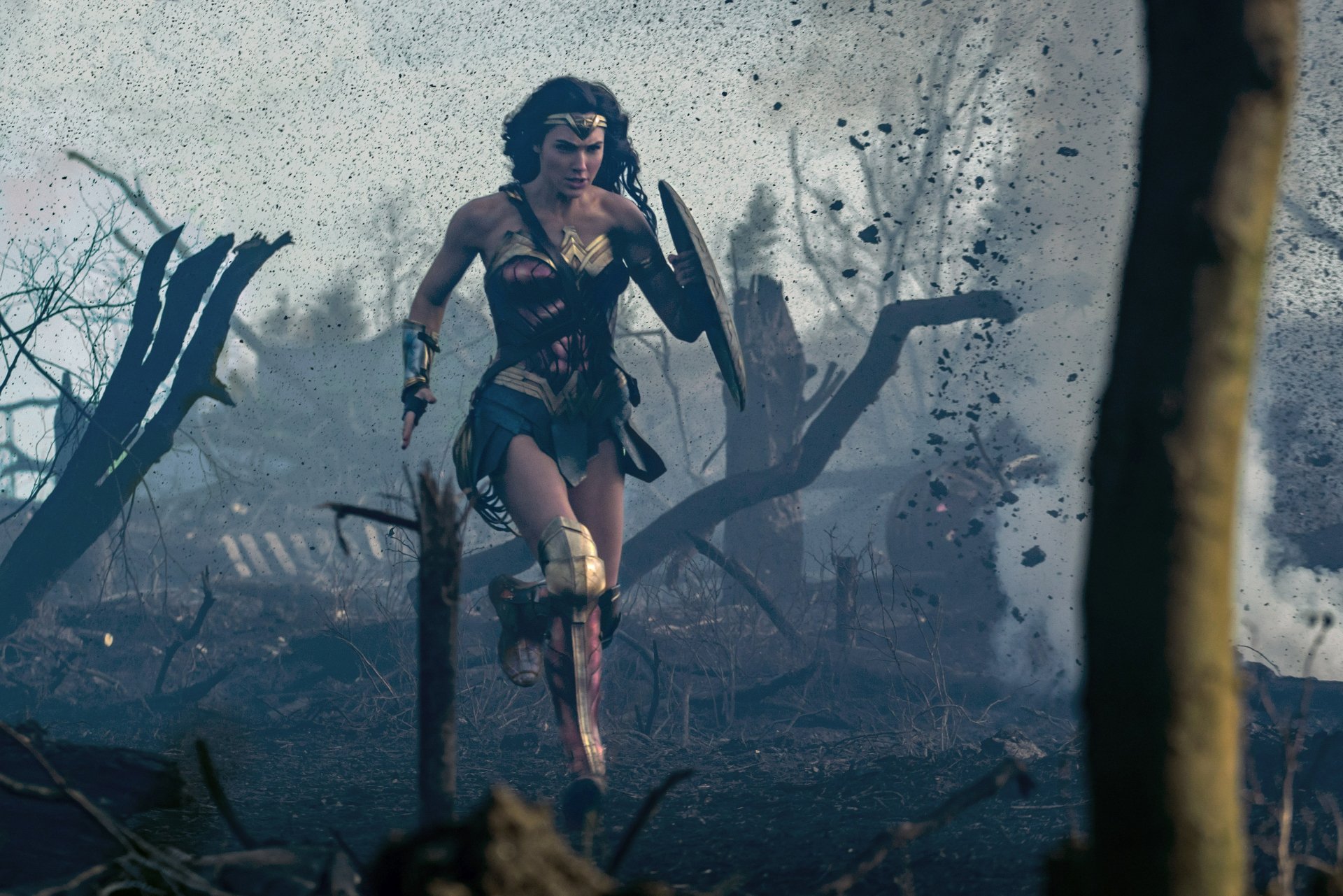 HD desktop wallpaper showing Gal Gadot as Wonder Woman, in an intense action scene amid debris and destruction.