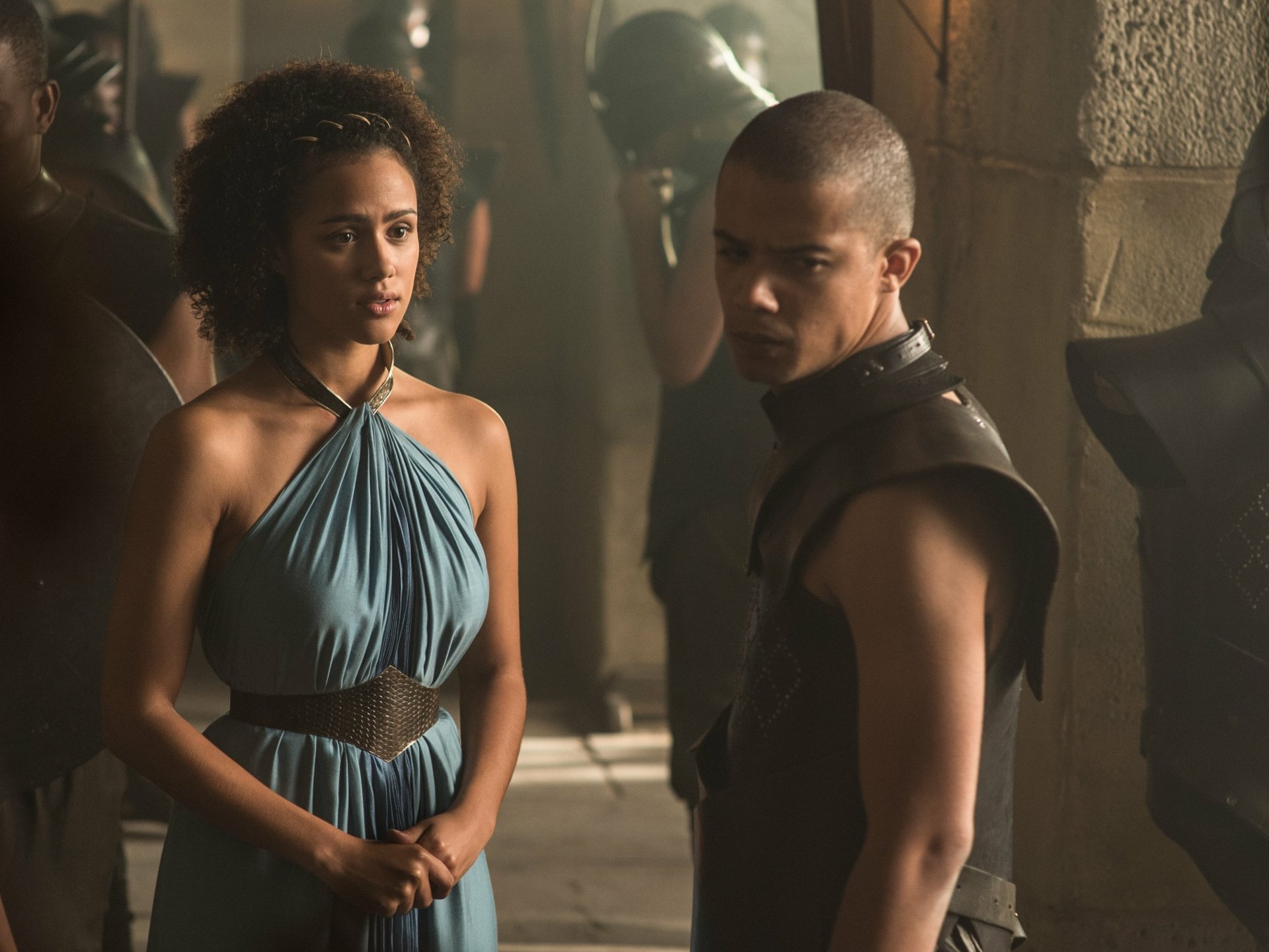 2K Quad HD desktop wallpaper from the TV show Game of Thrones: Grey Worm and Missandei stand in a dim stone hall, tense expressions.