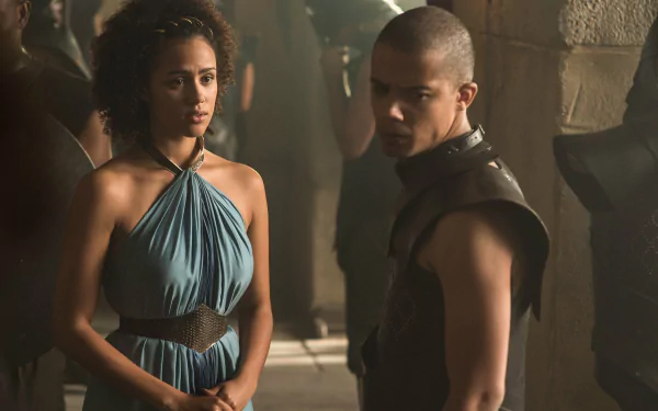 2K Quad HD desktop wallpaper from the TV show Game of Thrones: Grey Worm and Missandei stand in a dim stone hall, tense expressions.