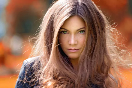 HD desktop wallpaper featuring a close-up of Sophie Breidenstein, a brunette model with green eyes and freckles, captured with a shallow depth of field.