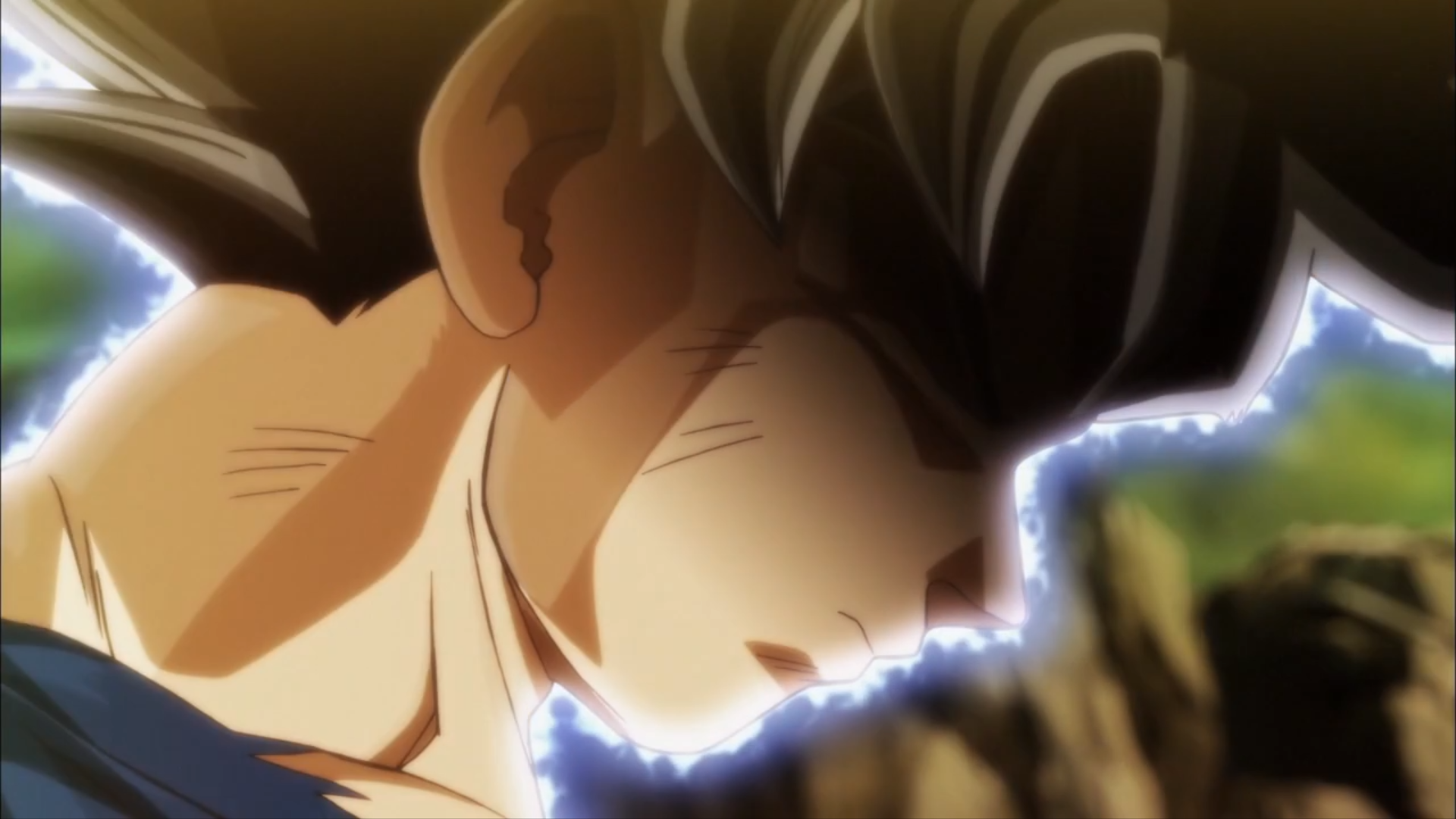 HD wallpaper of Goku in his Ultra Instinct form from Dragon Ball Super, showcasing a powerful and serene moment with a glowing aura around him.