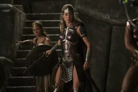 Doutzen Kroes in warrior armor from the Justice League (2017) movie, featured in a dramatic HD PC desktop wallpaper and background scene.