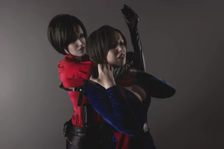 HD desktop wallpaper featuring a woman cosplaying as Ada Wong from the Resident Evil series, engaged in an intense, dramatic action scene against a gray background.
