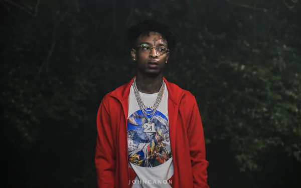 HD wallpaper of a person standing in a misty forest, wearing a red jacket and chain necklaces, providing a moody desktop background.