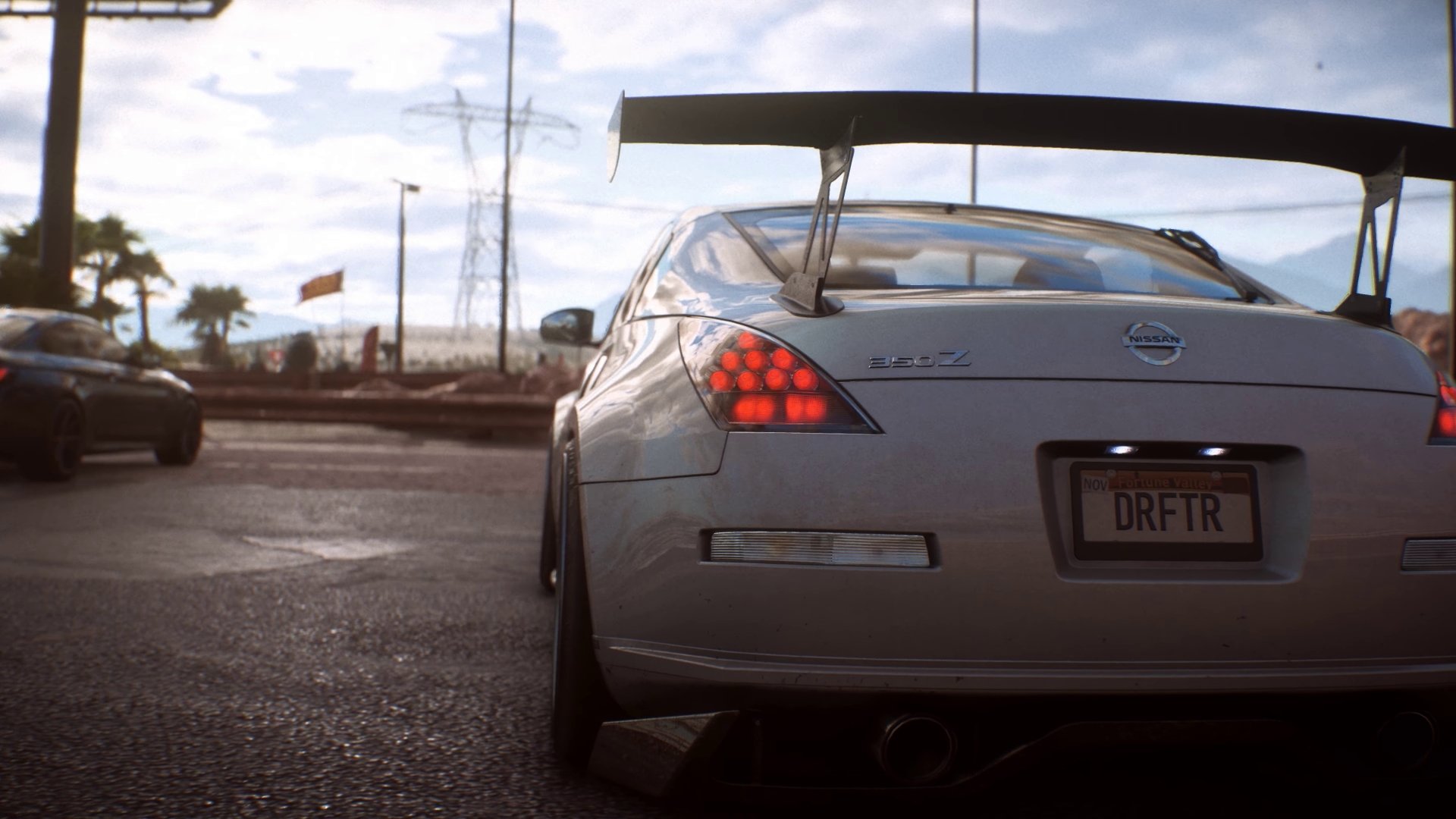 Rear view of a silver Nissan 350Z with a large spoiler and DRFTR plate on a wet street — HD PC desktop wallpaper from the video game Need for Speed Payback