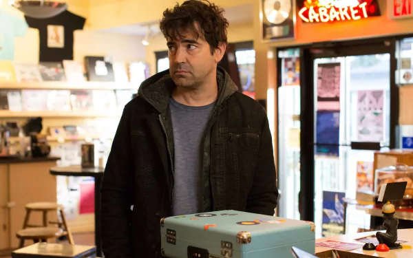 HD wallpaper featuring a scene from Loudermilk with a man standing in a store, portraying a character from the show.