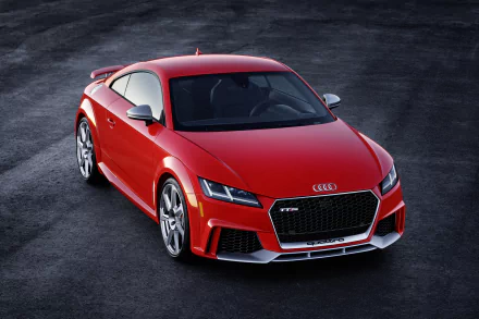Red Audi TT sports car showcased as a 4K Ultra HD desktop wallpaper, highlighting sleek design and dynamic presence on a dark asphalt background.