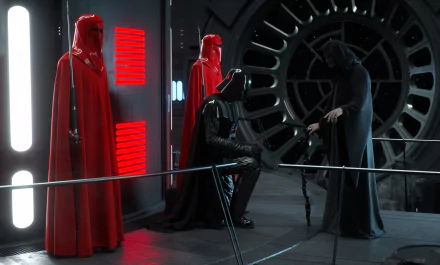 Darth Vader, flanked by Emperor's Royal Guard in red cloaks, stands in a dark sci-fi setting, creating a striking atmosphere for any Star Wars fan's HD desktop wallpaper.