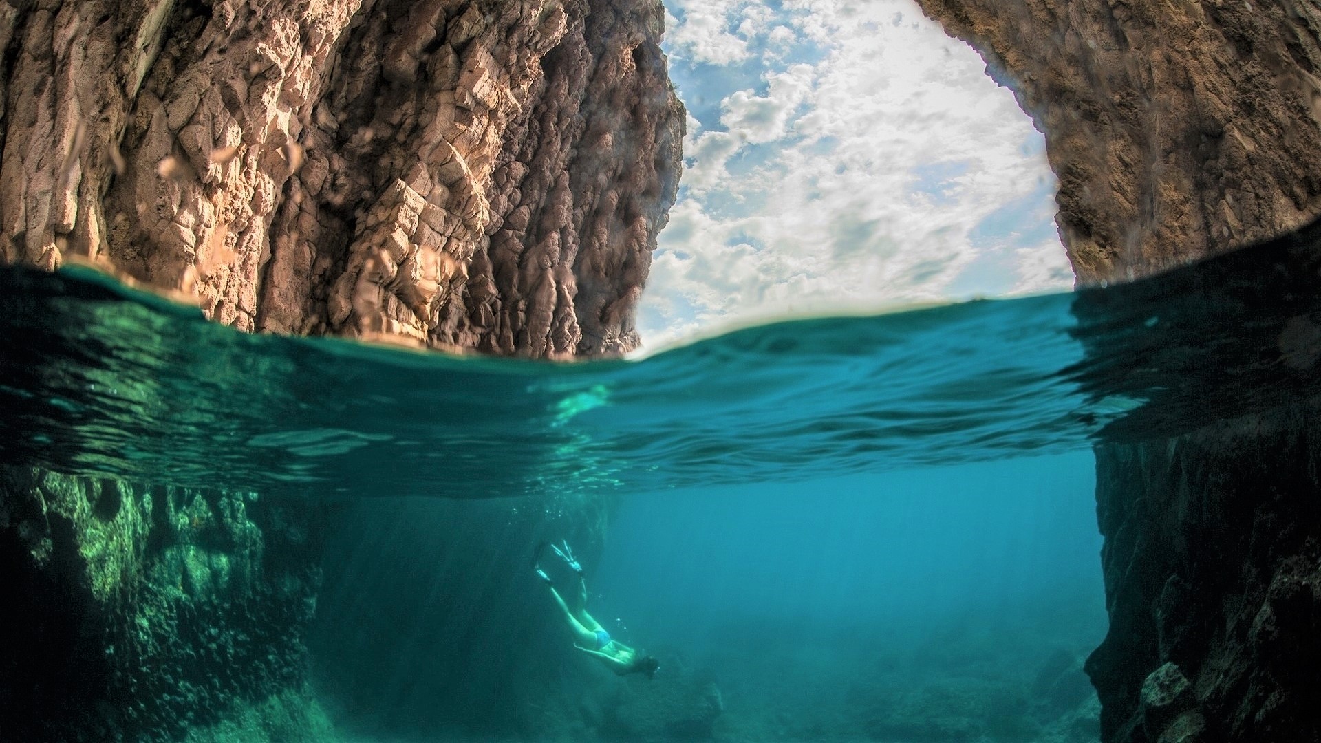 Scuba Diving Under Ocean Cave
