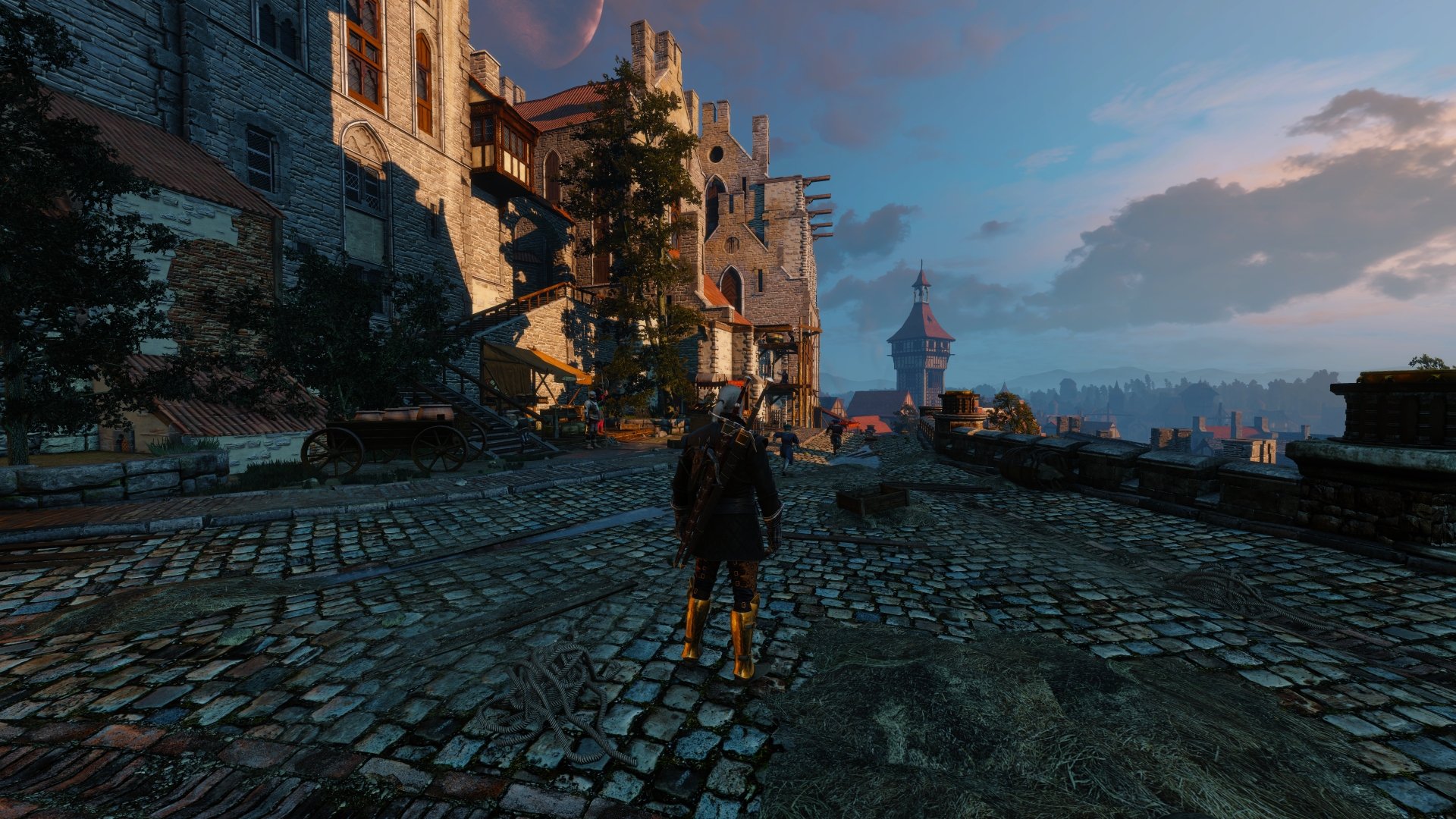 8K Ultra HD PC desktop wallpaper from the video game The Witcher 3: Wild Hunt, featuring a detailed cobblestone street with medieval buildings at sunset.