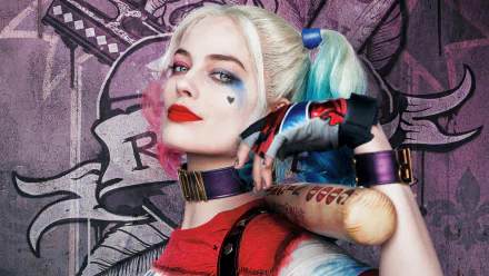 HD desktop wallpaper featuring Australian actress Margot Robbie as Harley Quinn from the movie Suicide Squad, showcasing her blonde hair, bold lipstick, and holding a bat against a graphic background.
