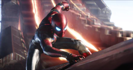 Spider-Man (Peter Parker) in an intense action scene from Avengers: Infinity War. The HD desktop wallpaper features the character portrayed by Tom Holland in his iconic suit.