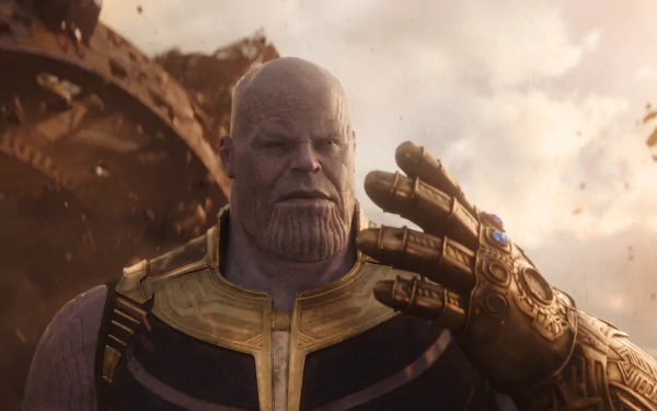 HD desktop wallpaper of Thanos, portrayed by Josh Brolin in the movie Avengers: Infinity War. Thanos is shown wearing his armor and the Infinity Gauntlet, with a menacing expression amidst a chaotic background.