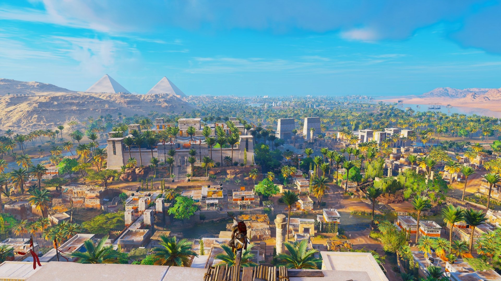 HD PC desktop wallpaper featuring Bayek of Siwa overlooking an ancient Egyptian cityscape from Assassin's Creed Origins.