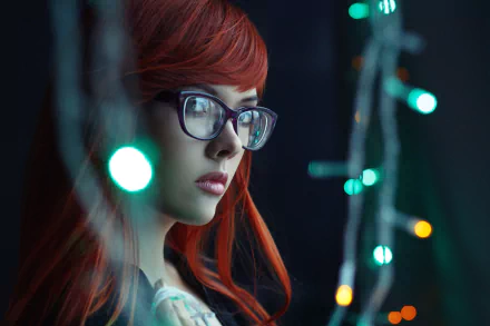 A close-up 4K Ultra HD wallpaper of a red-haired woman wearing glasses, illuminated by soft, colorful lights in a dark setting.