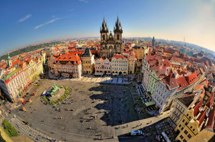 A stunning 4K Ultra HD view of Prague's historic city square, showcasing the iconic Gothic architecture under a clear sky in the Czech Republic.