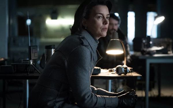 HD desktop wallpaper featuring a scene from the show Counterpart with a focused character in a dimly lit room.