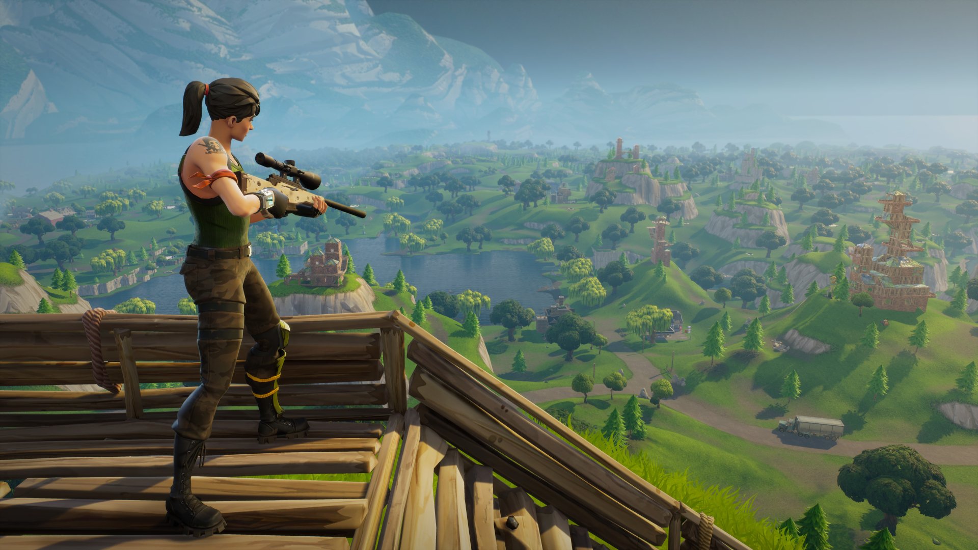 A Fortnite character stands atop a wooden structure, holding a sniper rifle, overlooking a vast, detailed landscape in this HD desktop wallpaper and background.
