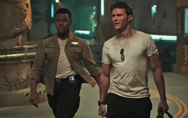HD desktop wallpaper featuring John Boyega and Scott Eastwood in a scene from the movie Pacific Rim: Uprising, showcasing a tense moment with both actors in character.