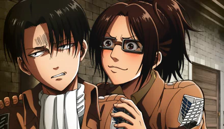 HD wallpaper featuring anime characters Hange Zoë and Levi Ackerman from Attack on Titan, with Hange smiling mischievously, and Levi displaying a serious expression against a dimly lit, stone background.