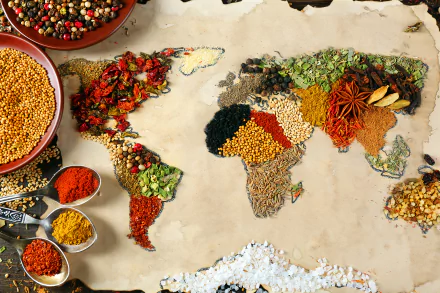 HD desktop wallpaper featuring a world map creatively crafted from a variety of vibrant spices and herbs, evoking a sense of global culinary exploration.