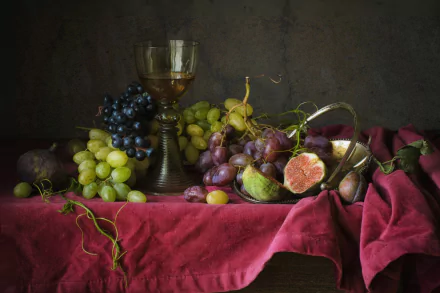 HD PC desktop wallpaper/background: still life of figs and assorted green, red and black grapes on a red cloth with a wine goblet, classic fruit food scene.