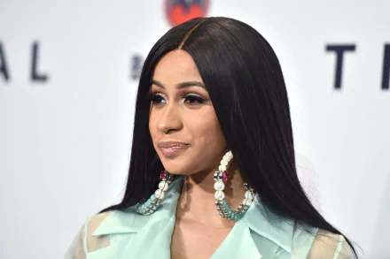 Close-up of Cardi B, showcasing her stylish look with long, straight hair and statement earrings, serving as a vibrant HD desktop wallpaper and background for music lovers.