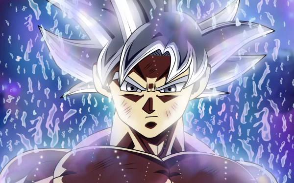 Ultra Instinct Goku from Dragon Ball Super emanates a powerful aura in this HD desktop wallpaper, capturing the intense energy and determination of the anime character.