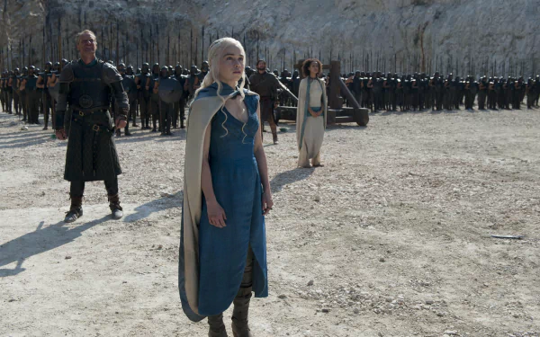 4K Ultra HD Game of Thrones wallpaper featuring Emilia Clarke as Daenerys Targaryen, Nathalie Emmanuel as Missandei, and Iain Glen as Jorah Mormont in a desert setting.