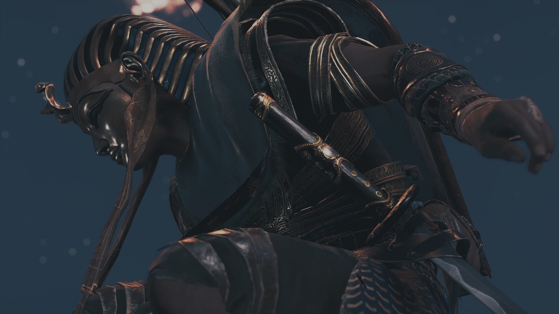 HD PC desktop wallpaper from the video game Assassin's Creed Origins: a shadowed warrior crouches in ornate Egyptian-style armor and a pharaoh-style mask.