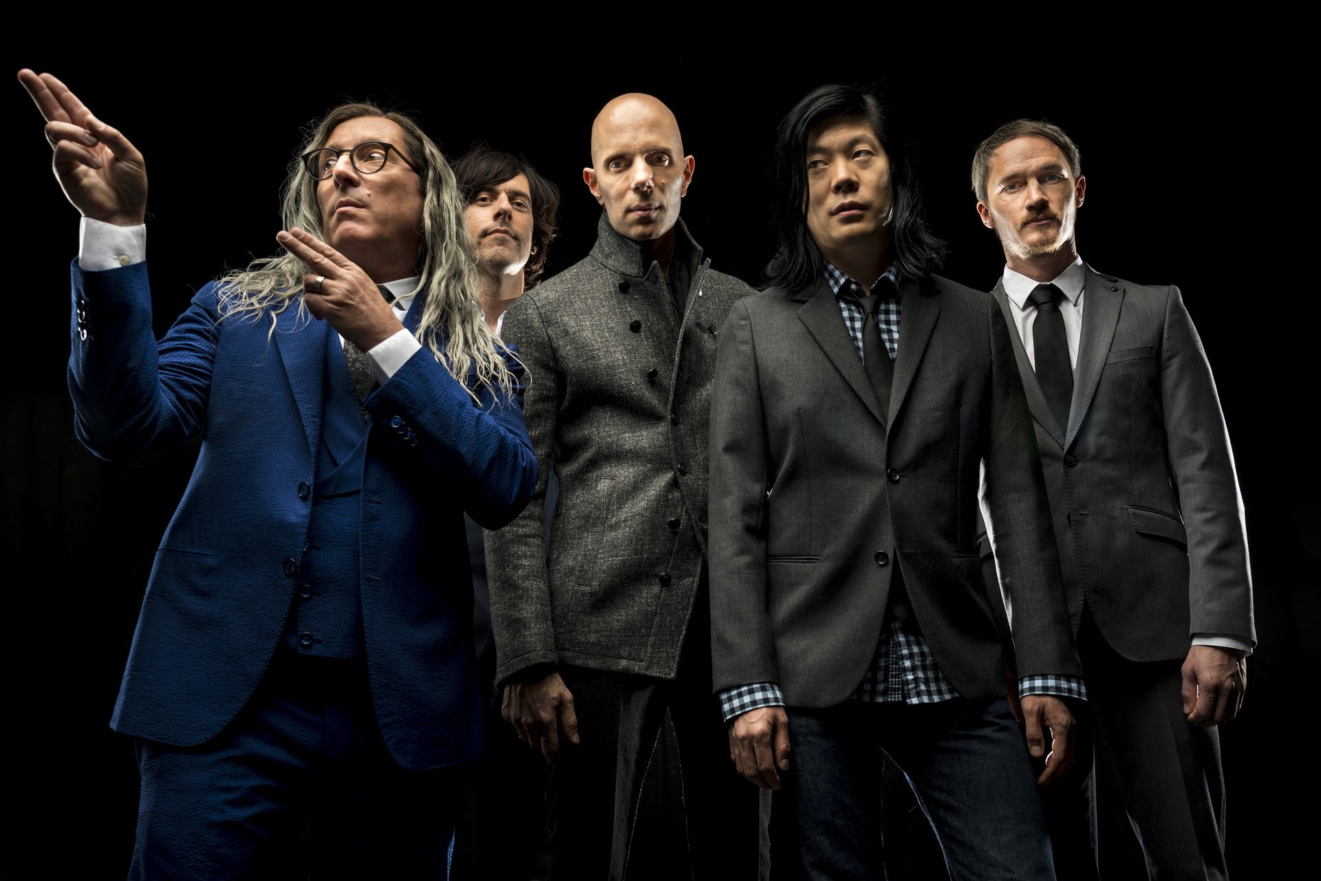 HD desktop wallpaper of A Perfect Circle band members standing confidently against a dark background.