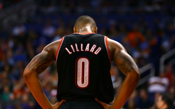 HD desktop wallpaper featuring Damian Lillard from behind in his black basketball jersey with the name Lillard and number 0.