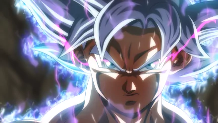 HD wallpaper of Goku from Dragon Ball Super, showcasing his Ultra Instinct form with intense energy aura, sharp focus, and glowing white hair.