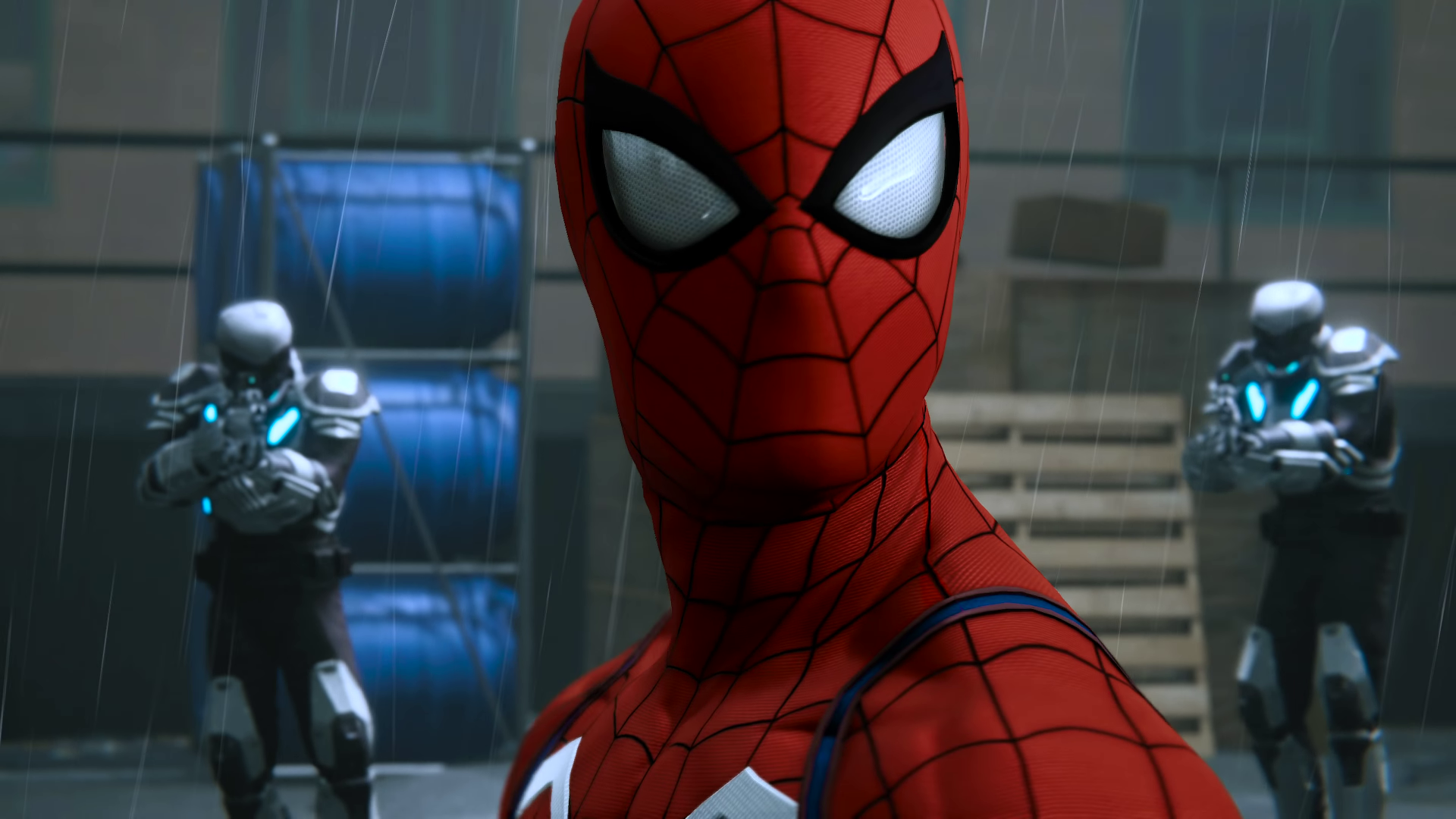 Close-up of Spider-Man from the Spider-Man (PS4) video game in a 4K Ultra HD PC desktop wallpaper: masked hero faces the camera in an industrial warehouse with armed guards behind him.