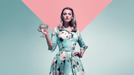 Blake Lively from the movie A Simple Favor poses confidently in a floral dress holding a martini glass, captured in a 4K Ultra HD PC desktop wallpaper.