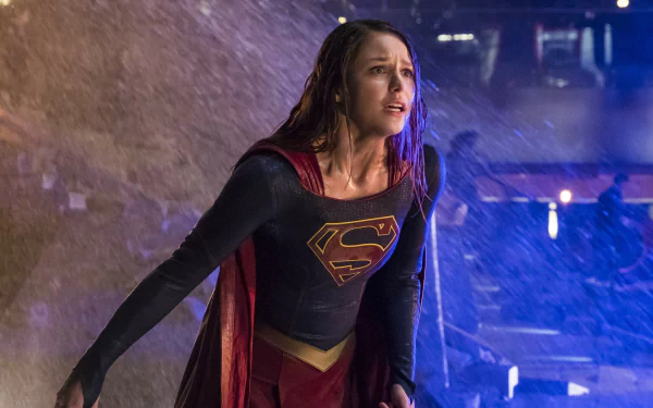 Melissa Benoist as Kara Zor-El in the TV show Supergirl, depicted in a dramatic scene with rain, featured as an HD PC desktop wallpaper and background.