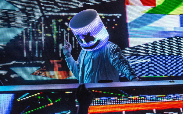 HD desktop wallpaper of DJ Marshmello performing on stage, wearing his iconic LED helmet, surrounded by vibrant digital graphics and music-themed visuals.