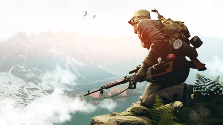 HD wallpaper of an adventurous soldier overlooking a mountainous landscape, embodying vigor, with soaring birds in the background.
