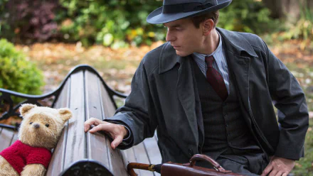 HD wallpaper featuring Christopher Robin and Winnie the Pooh on a bench, reflecting a heartwarming moment.