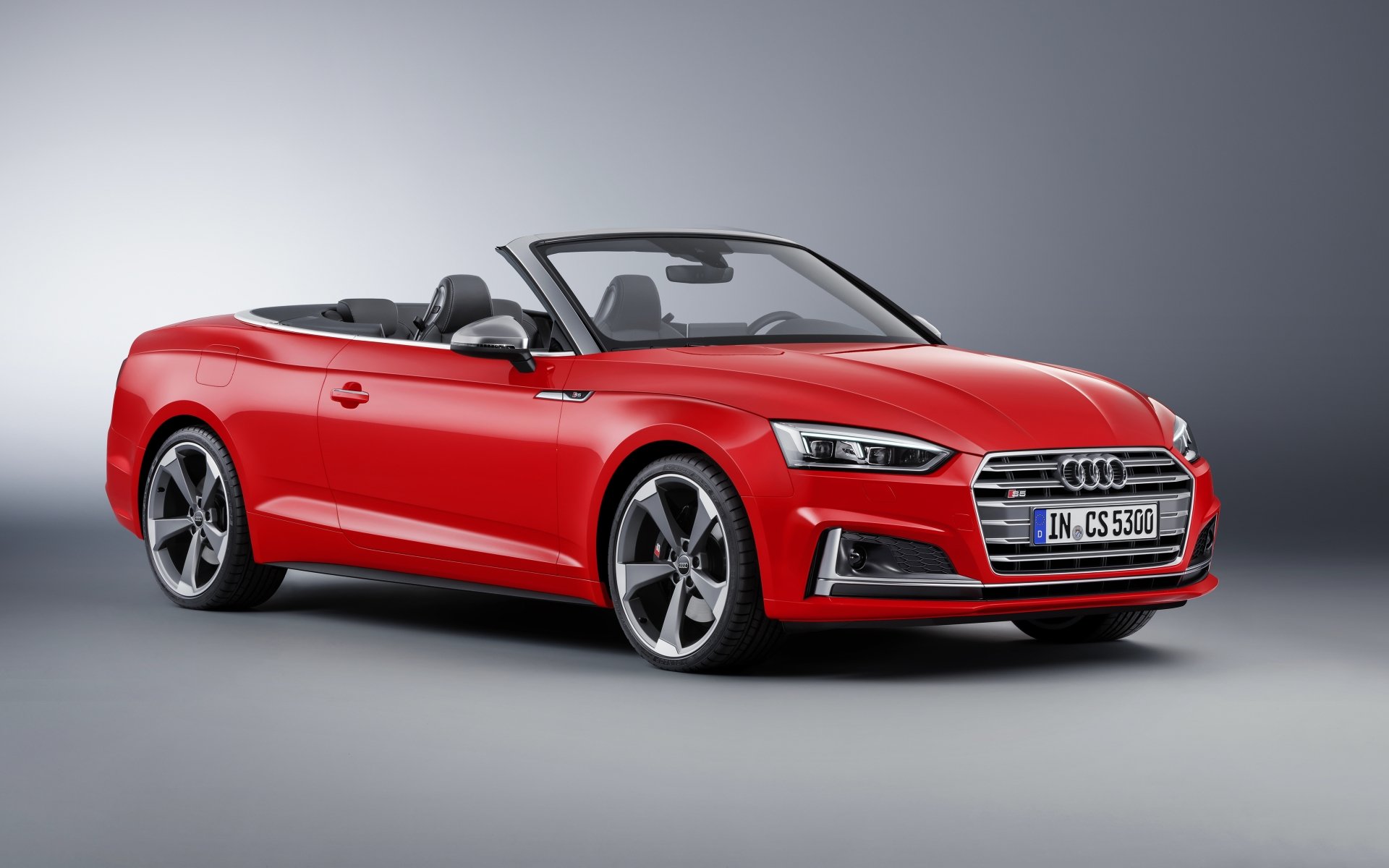 Red Audi S5 cabriolet sports car showcased in a sleek 4K Ultra HD PC desktop wallpaper, highlighting its modern design and luxury appeal.