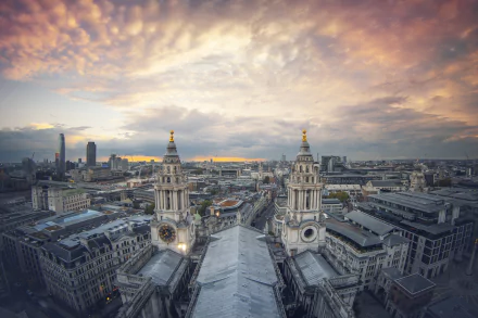 A panoramic cityscape of London, United Kingdom, featuring historic buildings under a dramatic, colorful sky, captured in HD for a PC desktop wallpaper.