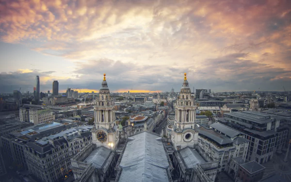 A panoramic cityscape of London, United Kingdom, featuring historic buildings under a dramatic, colorful sky, captured in HD for a PC desktop wallpaper.