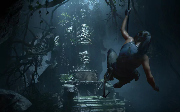 Lara Croft from Shadow of the Tomb Raider swings through a moonlit jungle cavern toward an ancient stone idol — 4K Ultra HD PC desktop wallpaper/background.