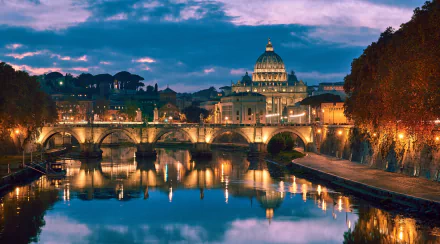 4K Ultra HD view of Ponte Sant'Angelo in Rome, showcasing the historic bridge and illuminated cityscape reflected in the Tiber River at dusk.
