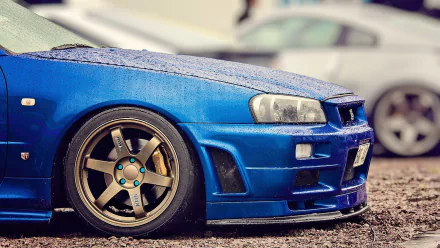 Close-up of a blue Nissan Skyline GT-R with detailed wheels, captured as an HD PC desktop wallpaper and background.