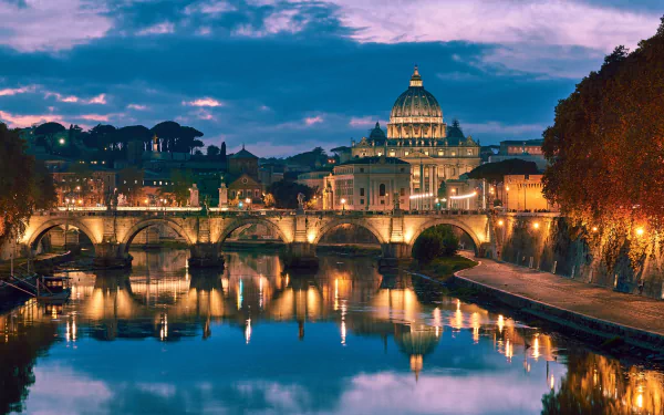 4K Ultra HD view of Ponte Sant'Angelo in Rome, showcasing the historic bridge and illuminated cityscape reflected in the Tiber River at dusk.